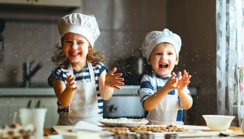 kids playing in a kitchen.