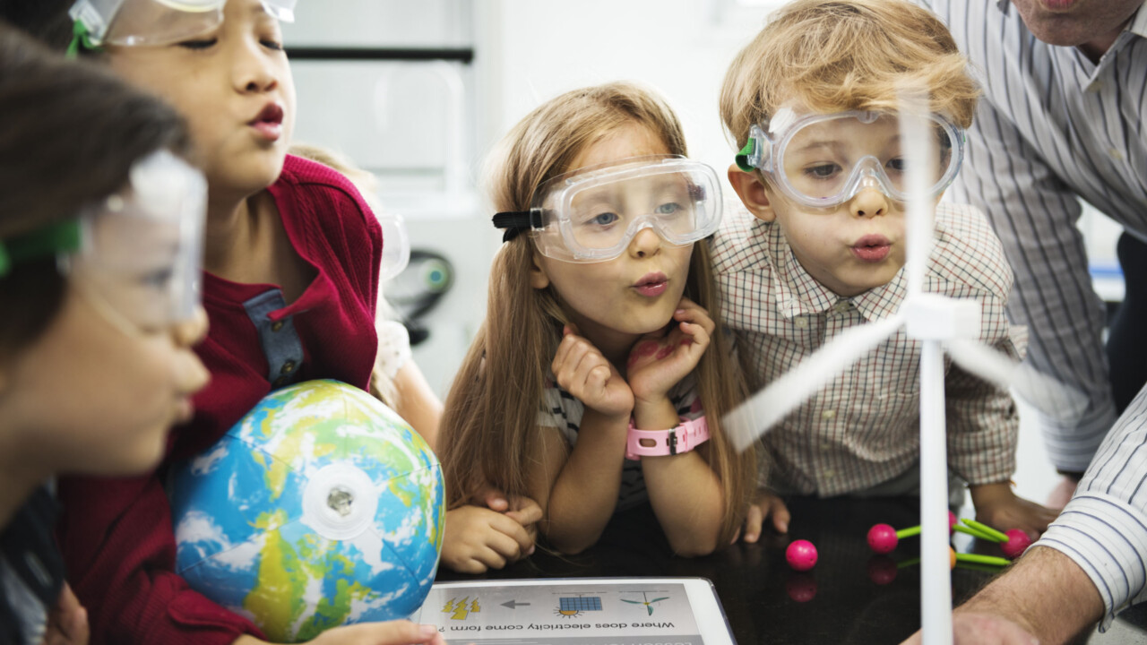 kids performing a science experiment.