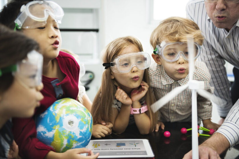 kids performing a science experiment.